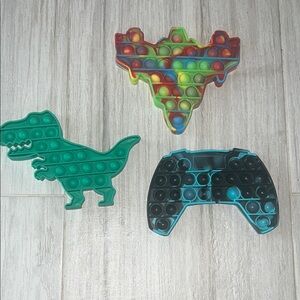 Three kids Poppit toys fidget play stress relief